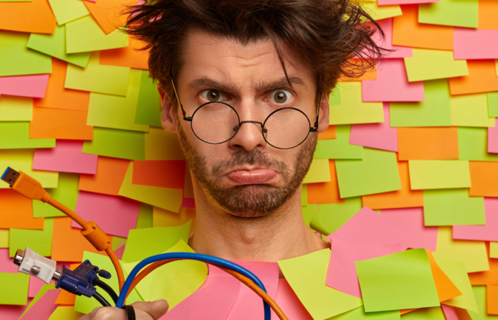 confused looking client surrounded by sticky post it notes